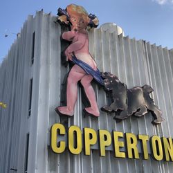 The Coppertone Girl Sign