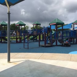 Westside Event Center - Both play structures. The one in the back has a taller tube slide. It also has a short "zip line" area.