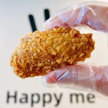 Hey Chicken! - a hand holding a piece of fried chicken - Chicken Shop Near Me - Walnut, California