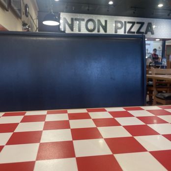 Denton Pizza - Table and sign - Italian Near Me - Denton, Maryland