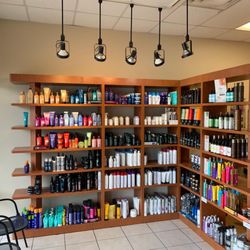Hair Cuttery - The shelves with products available for purchase at a Hair Cuttery Salon.