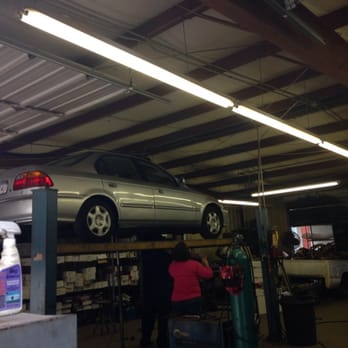 Ace Muffler Shop - Lady inspecting my blown muffler. - Auto Repair Near Me - Durham, North Carolina Ace Muffler Shop - Lady inspecting my blown muffler. - Auto Repair Near Me - Durham, North Carolina