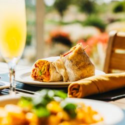 Rams Hill Golf Club - 1st Tee Breakfast Burrito with a mimosa