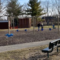 McHattie Park - Play ground swings in woodchiped area