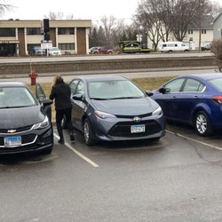 Budget Rent A Car System - Budget rental car parking lot and agent checking out our rental car