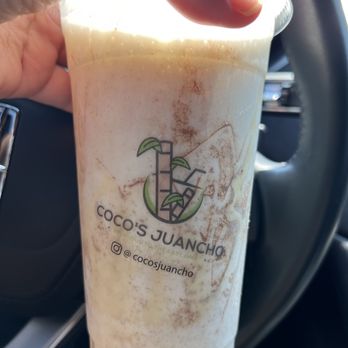 Coco's Juancho - a hand holding a cup of coffee - Food Trucks Near Me - Miami, Florida