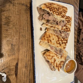 Zea Rotisserie & Bar - Philly Beef Panini - Whole - New American Near Me - Kenner, Louisiana Zea Rotisserie & Bar - Philly Beef Panini - Whole - New American Near Me - Kenner, Louisiana