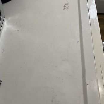 Sandia Green Clean - Another area of the house that was unaddressed - A white, slightly worn surface with scratches, scuffs, and a small, partially visible sticker or label. - Home Cleaning Near Me - Albuquerque, New Mexico
