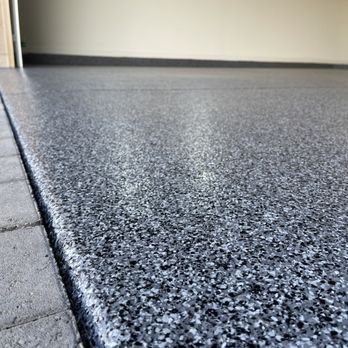 Garage Pros 1 - a close up of a garage floor - Flooring Near Me Garage Pros 1 - a close up of a garage floor - Flooring Near Me
