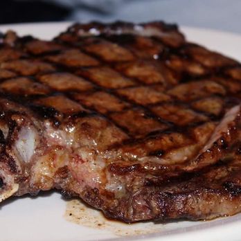 Texas Roadhouse - a steak on a white plate - American Near Me - Bismarck, North Dakota