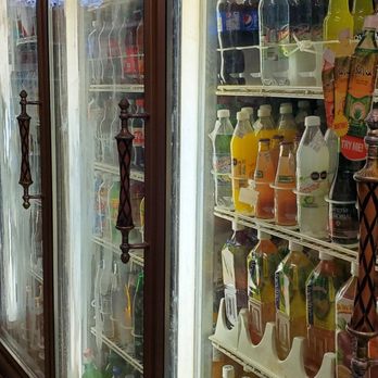 Dos Hermanos Market - a row of refrigerated sodas - International Grocery Near Me - Ypsilanti, Michigan