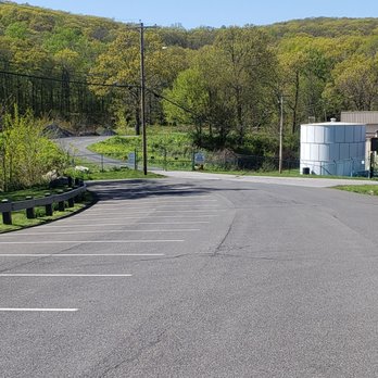 Illinois Mountain Park - The entrance to the park from the parking lot, with a private road along pedestrians to be shared. The trails are up ahead - 5/10/2022 - Hiking Near Me - Highland, New York