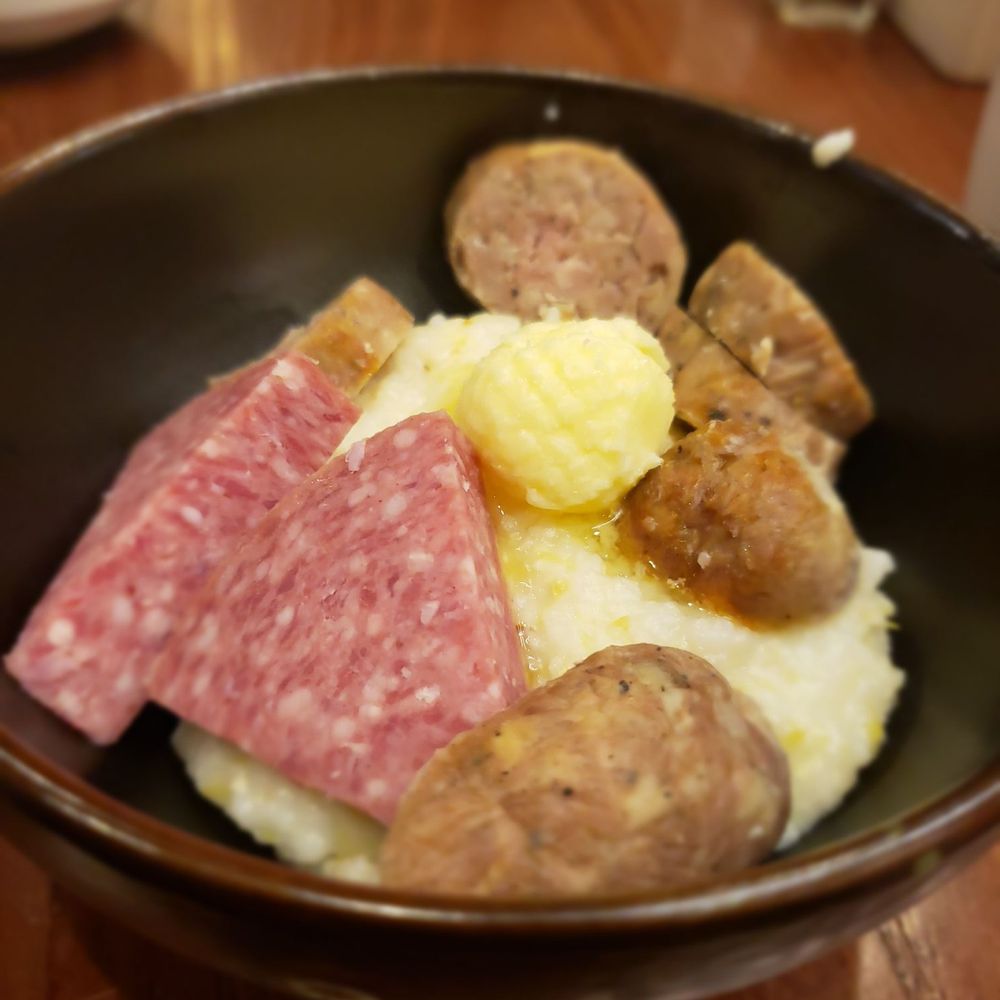 Fork Lore - Yellow stone grits with local sausage and ham - Breakfast & Brunch Near Me - Asheville, North Carolina Fork Lore - Yellow stone grits with local sausage and ham - Breakfast & Brunch Near Me - Asheville, North Carolina