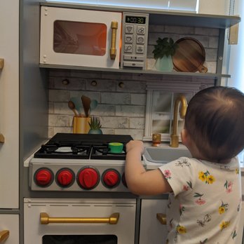 John Sells Stuff - Baby enjoying her brand new KidKraft UPTOWN ELITE PLAY KITCHEN with microwave sounds, gas stovetop sounds & lights, and ice dispenser! - Discount Store Near Me - Redlands, California