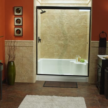 Re-Bath - a bathroom with orange walls and a white rug - General Contractors Near Me - Paducah, Kentucky