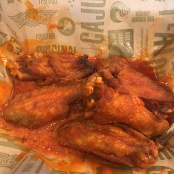 Wingstop - a basket of chicken wings with sauce - Chicken Wings Near Me - Macon, Georgia Wingstop - a basket of chicken wings with sauce - Chicken Wings Near Me - Macon, Georgia