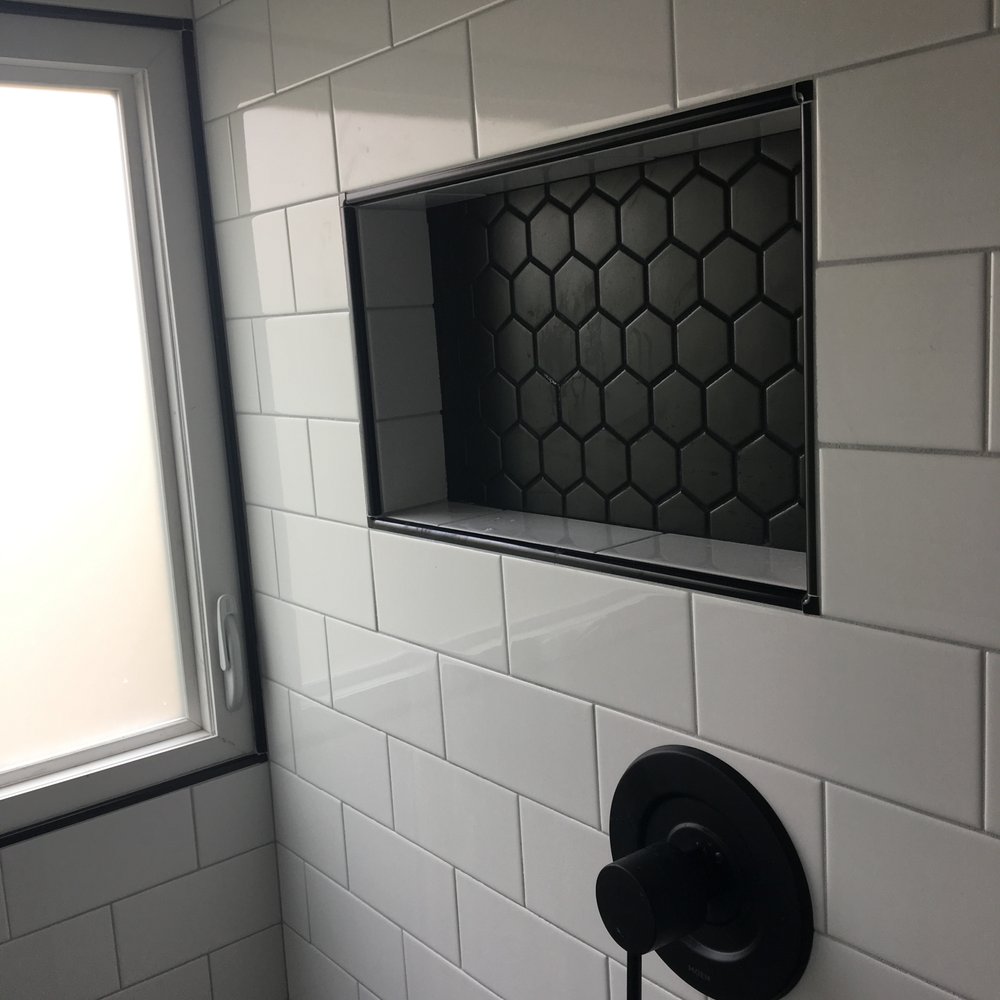 Albert Tile & Fine Stone - a window in the shower - Flooring Near Me