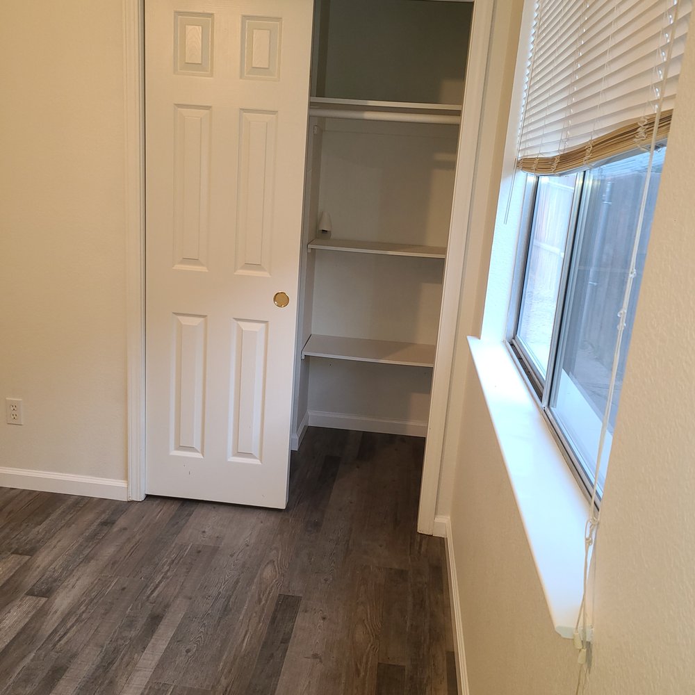 Hidalgo’s Flooring - a closet in a bedroom - Flooring Near Me Hidalgo’s Flooring - a closet in a bedroom - Flooring Near Me
