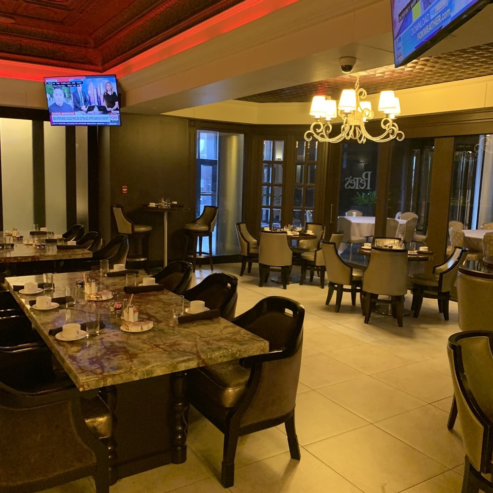 Pete's Bistro and Lounge - a dining room with a television - Bars Near Me - New Orleans, Louisiana