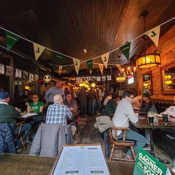 Le Trèfle - people sitting at tables in a pub - Irish Pub Near Me - Montreal, Quebec