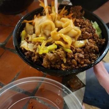 Julie's Handmade Noodles - a bowl of noodles with chopsticks - Chinese Near Me - Austin, Texas Julie's Handmade Noodles - a bowl of noodles with chopsticks - Chinese Near Me - Austin, Texas