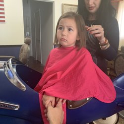 My daughters first haircut. You can see the excitement on her face. Lol