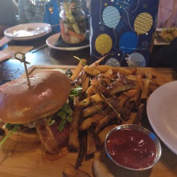The Mill Steakhouse + Spirits - 1/2 of a burger - Sports Bars Near Me - Milton, Washington The Mill Steakhouse + Spirits - 1/2 of a burger - Sports Bars Near Me - Milton, Washington