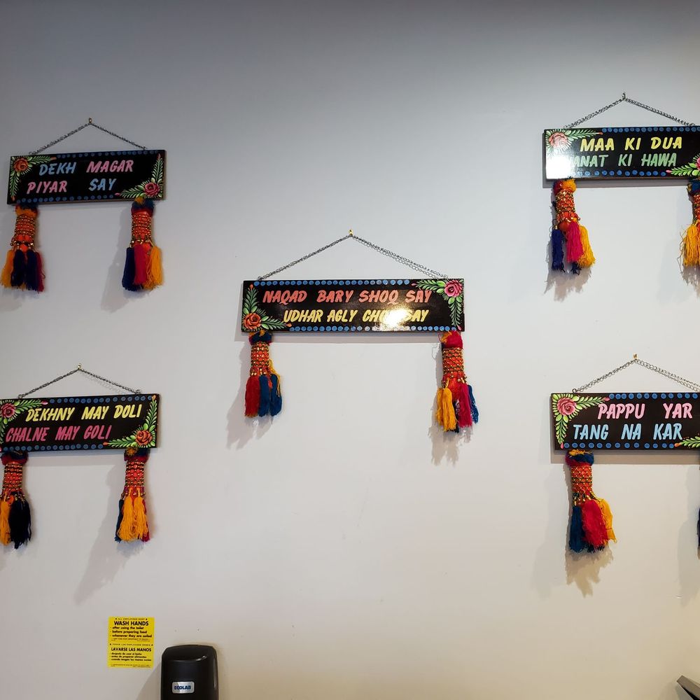 Kababjees - a variety of tassels hanging on a wall - Halal Near Me - Hicksville, New York
