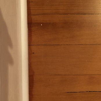 Bella's Flooring - Pooled varnish along the trim. - Flooring Near Me - Seattle, Washington
