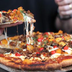 Cilantro on the Lake - Boar Chorizo Pizza ($36) - mushrooms, roasted squash, caramelized onions, sweet drop peppers, mozzarella cheese