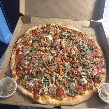 Brooklyn Pizza - Godfather pizza with onions on side - Pizza Near Me - Seminole, Florida