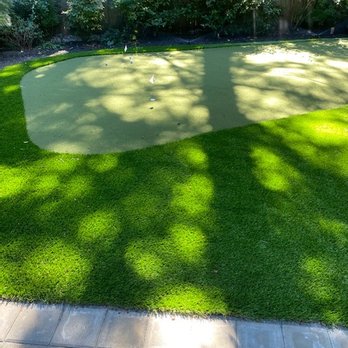 Rubi Construction - a putting green in a backyard - Fences & Gates Near Me Rubi Construction - a putting green in a backyard - Fences & Gates Near Me