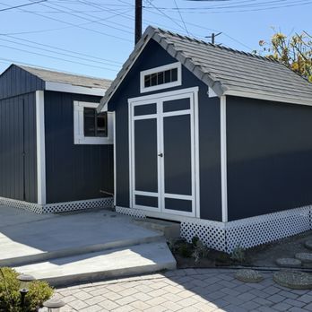 Super Painting - Storage sheds painted blue grey same color as shutters with white accents. - Painters Near Me - Los Angeles, California