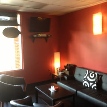 Hookah Hotspot - a living room with red walls - Hookah Bars Near Me - Charlotte, North Carolina