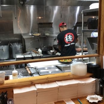 Noodle Man - Countertop area where you can watch them make the noodles and cook the food. - Noodles Near Me - Virginia Beach, Virginia