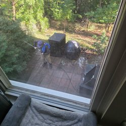 J Morgan's Power washing service - He is cleaning our fireplace.
