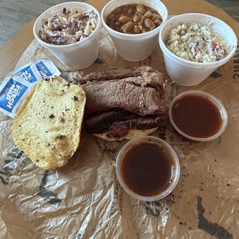 Crydermans Barbecue - Good amount of brisket on the brisket sandwich. Coleslaw, baked beans, potato salad. Hot barbecue sauce and sweet barbecue sauce. - Barbeque Near Me - Melbourne, Florida