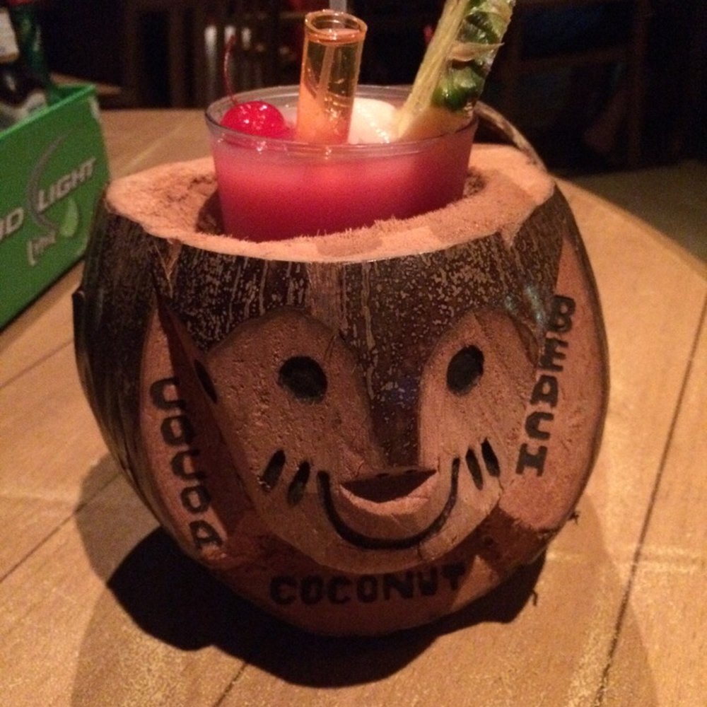 Coconuts On The Beach - Pass in the Ass with the souvenir coconut mug - Bars Near Me - Cocoa Beach, Florida