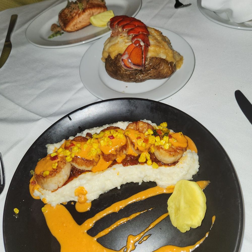 Angelo's 677 Prime - Faroe island salmon, lobster baked potato, and jumbo dayboat scallops. Everything was phenomenal!! - Steakhouses Near Me - Albany, New York