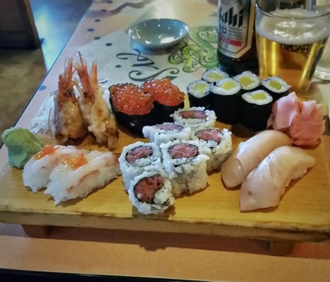 Photo of Sushi Tomo - Palo Alto, CA, US. Assorted sushi: amaebi, ikura, nigitoro roll, oshinko roll, hamachi nigiri