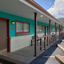 Raton Pass Motor Inn - Raton Pass Motor Inn-western wing breezeway. Bartlett Mesa in the background.