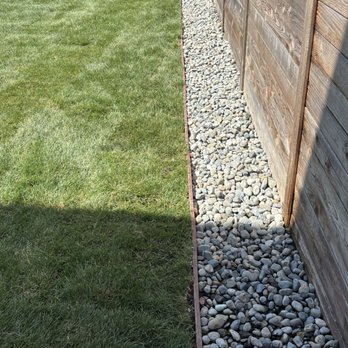 Dove Landscaping - River rock border along the fence - Masonry/Concrete Near Me - Tacoma, Washington Dove Landscaping - River rock border along the fence - Masonry/Concrete Near Me - Tacoma, Washington