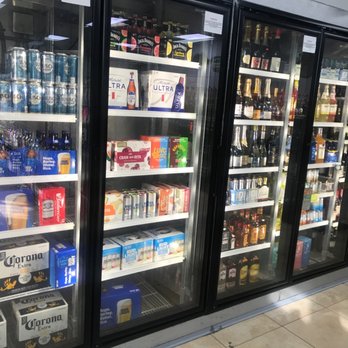 9 liquor - a refrigerated refrigerator in a grocery store - Beer, Wine & Spirits Near Me - Houston, Texas