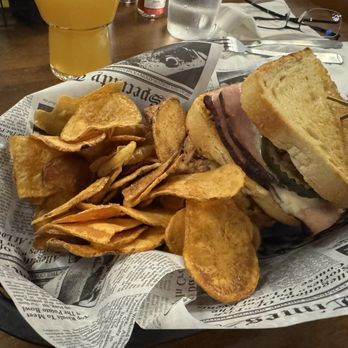 Lil Beaver Brewery - BEER BRAISED CUBANO PANINI Beer braised pulled pork, roasted ham, Swiss cheese, pickles and a spicy ale mustard with pub chips - Breweries Near Me - Bloomington, Illinois
