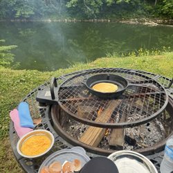 Cave Country Canoes - Cheesy eggs and pancakes over the fire while overlooking the river