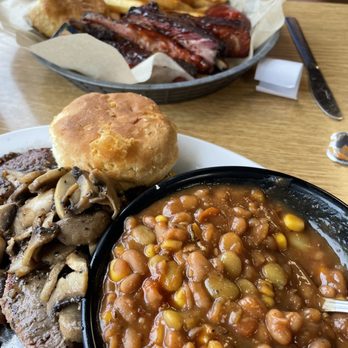 The Smoking Mule - Ribeye steak covered in mushrooms. Best baked beans in my life. - American Near Me - Chamberlain, South Dakota