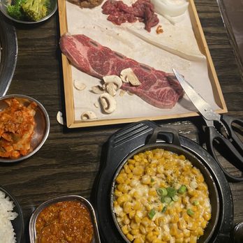 GoGo Gogi Korean BBQ - Had to cut the rib so it can fit on the plate.. one of the sides was buttered corn with cheese. My friend ordered kimchi pancake. - Korean Near Me - San Angelo, Texas GoGo Gogi Korean BBQ - Had to cut the rib so it can fit on the plate.. one of the sides was buttered corn with cheese. My friend ordered kimchi pancake. - Korean Near Me - San Angelo, Texas