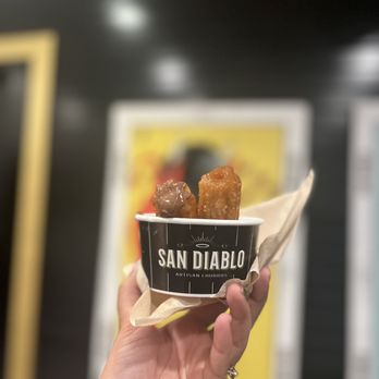 San Diablo Artisan Churros - a hand holding a cup of churros - Caterers Near Me - Lehi, Utah San Diablo Artisan Churros - a hand holding a cup of churros - Caterers Near Me - Lehi, Utah