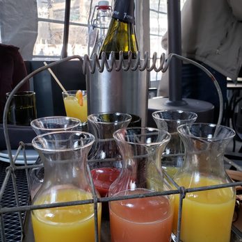 Siena Tavern - Mimosa kit with green puree, strawberry puree, mango puree and orange juice - Italian Near Me - Chicago, Illinois Siena Tavern - Mimosa kit with green puree, strawberry puree, mango puree and orange juice - Italian Near Me - Chicago, Illinois