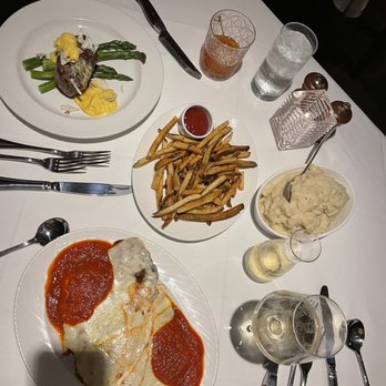 The Palm - Chicago - Chicken Parmesan, 8 oz fillet -- Oscar style, garlic herb mashed potatoes, French fries - Steakhouses Near Me - Chicago, Illinois The Palm - Chicago - Chicken Parmesan, 8 oz fillet -- Oscar style, garlic herb mashed potatoes, French fries - Steakhouses Near Me - Chicago, Illinois